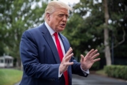 FILE - President Donald Trump speaks with reporters on the South Lawn of the White House, July 31, 2020.