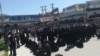 In this photo sent to VOA Persian by an audience member, residents of the southern Iranian city of Kazerun, many of them women dressed in black chadors, join a protest on May 17, 2018, after security forces violently cracked down on demonstrators the night before, killing at least one person. The protesters oppose a government plan to divide their city administratively.
