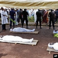 Bodies of people killed during a rally are seen at the capital's main mosque in Conakry, Guinea (Oct 2009 file photo)