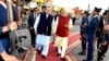In this photo released by Press Information Department, India's Prime Minister Narendra Modi, right, reviews a guard of honor with his Pakistani counterpart, Nawaz Sharif, in Lahore, Pakistan, Dec. 25, 2015.