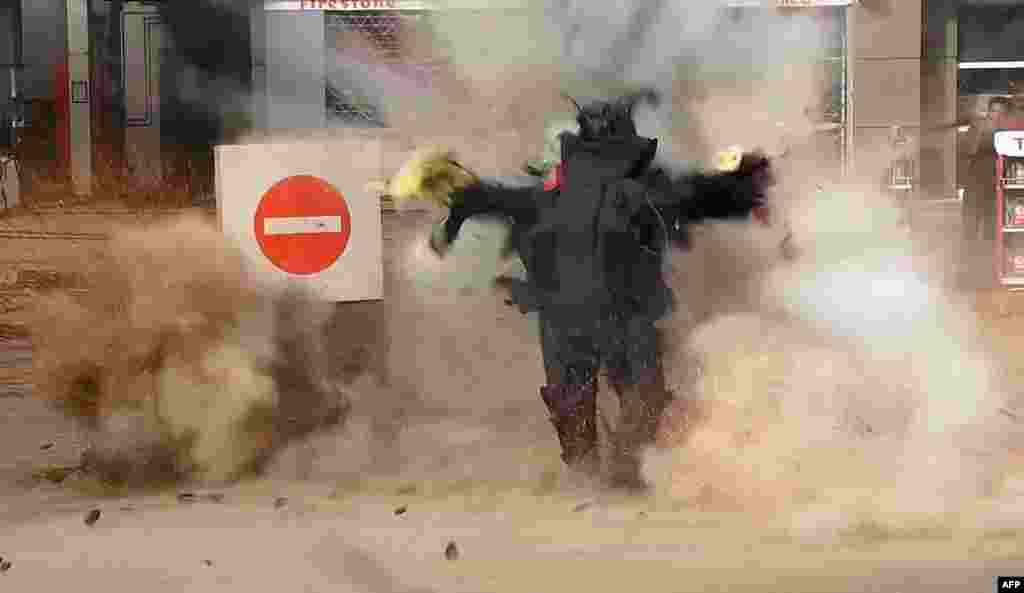 This still image grab taken from a video on Jan. 6, 2015 by the Al-Youm al-Saabi newspaper, shows an Egyptian police officer being blown up as he was trying to defuse a&nbsp; bomb outside a petrol station in Cairo. The officer was killed and jihadists claimed responsibility, police said. Three employees were also wounded when the device, hidden in a flower pot, exploded near a police station on Al-Harram street.