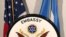 A U.S. Embassy seal is displayed in front of U.S. and Somali flags. (Source - Twitter @US2SOMALIA)