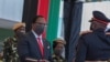 Malawi President-elect Lazarus Chakwera receives a sword of office as commander-in-chief of the Malawi Armed Forces during his inauguration at the Kamuzu Baracks, the Malawi Defence Force Headquarters, in Lilongwe, July 6, 2020.