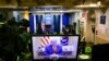 An image on a monitor shows U.S. President Donald Trump speaking during in a video posted on the White House Twitter feed, in the empty Brady Briefing Room of the White House in Washington, Jan. 13, 2021.