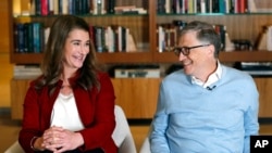 FILE - Bill and Melinda Gates smile at each other during an interview in Kirkland, Wash., Feb. 1, 2019.