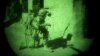 A coalition soldier in Afghanistan is seen through a night vision device (file photo).