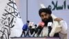 FILE - Taliban chief spokesman Zabihullah Mujahid speaks during an event in Kabul, Afghanistan, Nov. 25, 2021. 