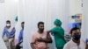 People are administered COVID-19 vaccine in Mumbai, India, April 13, 2021. The country of almost 1.4 billion people is seeing a crippling surge of infections that is threatening to overwhelm hospitals in hard-hit cities.