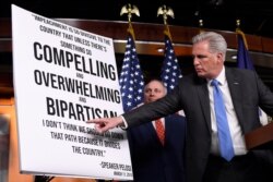 House Minority Leader Kevin McCarthy of Calif., right, standing with House Minority Whip Steve Scalise, R-La., left, speaks during a news conference on Capitol Hill in Washington, Dec. 3, 2019.