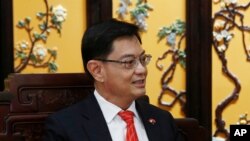 Singapore's Deputy Prime Minister Heng Swee Keat attends a meeting with Chinese Vice Premier Han Zheng (not pictured) at Diaoyutai state guesthouse in Beijing, Wednesday, May 22, 2019. (Florence Lo/Pool Photo via AP)