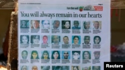 Guntingan surat kabar memperlihatkan para korban yang dibunuh dalam penyerangan di Mal Westgate, Kenya, Nairobi (30/9). (Reuters/Thomas Mukoya)