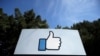 FILE - The thumbs-up Like logo is shown on a sign at Facebook headquarters in Menlo Park, Calif., April 14, 2020. 