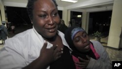 Relatives cry for their loved one as he is brought into hospital after an explosion, al-Shabab sympathizers are suspected in many of the blast attacks, Dec. 7, 2012.