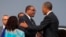 President Barack Obama, right, shakes hands with Ethiopian Prime Minister Hailemariam Desalegna after arriving at Addis Ababa Bole International Airport, on Sunday, July 26, 2015, in Addis Ababa. 
