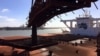 FILE - A bulk carrier is loaded with iron ore at Port Hedland, Western Australia. Forecasters said Feb. 14, 2025, that Cyclone Zeila was moving south toward Port Hedland, with landfall expected in the afternoon. 