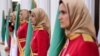 FILE - Mujahedin-e Khalq honor guard members stand watch in Manza, Albania, July 12, 2019. An Iranian paramilitary network was allegedly targeting Mujahedin-e Khalq group members in Albania, police said Wednesday.