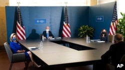 President-elect Joe Biden speaks during a meeting with Vice President-elect Kamala Harris, right, Senate Minority Leader Chuck Schumer and House Speaker Nancy Pelosi, Nov. 20, 2020, in Wilmington, Del. 