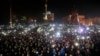 Anti-government protesters light torches and mobile devices during a rally in Independence Square in Kyiv, Ukraine, Feb. 21, 2014.