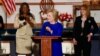 Democratic presidential candidate Hillary Clinton speaks at Central Baptist Church in Columbia, S.C., joined by Sybrina Fulton, left, the mother of shooting victim Trayvon Martin, and former U.S. Representative Gabrielle Giffords. (B. Allen/VOA)