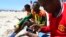FILE - A Somali man browses the internet on his mobile phone at a beach in Somalia's capital Mogadishu, January 10, 2014.