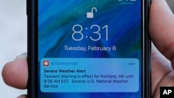 FILE - An alert is displayed on a phone Feb. 6, 2018, in Portland, Maine.