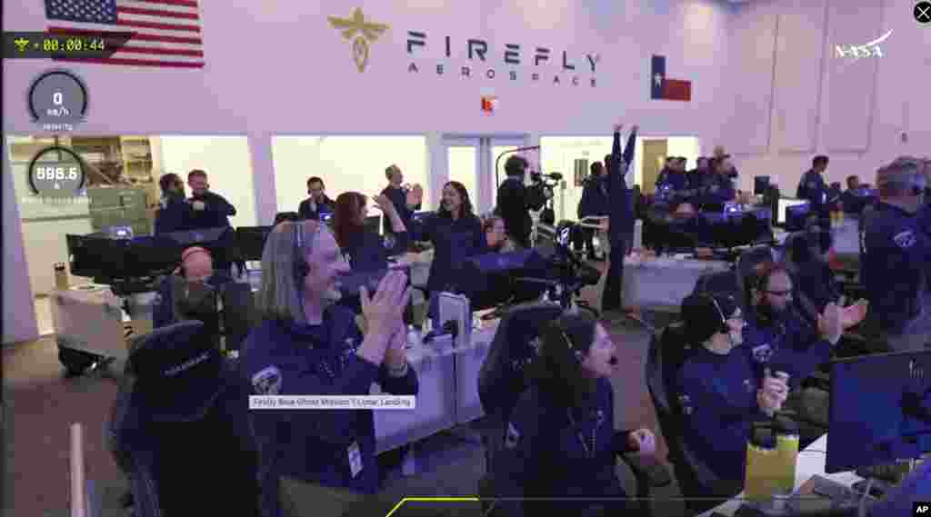 Staff at the Mission Control outside Austin, Texas celebrating as lunar lander Blue Ghost touches down on the moon with a special delivery for NASA, Sunday, March 2, 2025. (NASA/Firefly Aerospace via AP)