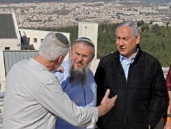 Israeli Prime Minister Benjamin Netanyahu, right, meets with heads of Israeli settlement authorities at the Alon Shvut settlement, in the Gush Etzion block, in the occupied the West Bank, November 19, 2019.