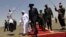South Sudanese President Salva Kiir, center, walks with Sudanese counterpart Omar al-Bashir, Khartoum, Oct. 2011 (file photo).