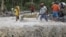 Residents cross a river with the body of a child after retrieving it from the flash flood-hit village of Andap, in New Bataan township, Compostela Valley in southern Philippines, December 5, 2012.