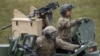 FILE - U.S. soldiers sit in a tank during a military exercise in Grafenwoehr, Germany, May 12, 2017.