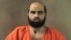 Undated file photo provided by the Bell County Sheriff's Department shows Nidal Hasan, the Army psychiatrist charged in the deadly 2009 Fort Hood shooting rampage.