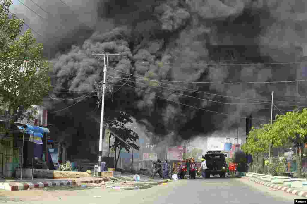 Firemen attempt to extinguish fires during riots in Meikhtila March 22, 2013.&nbsp;