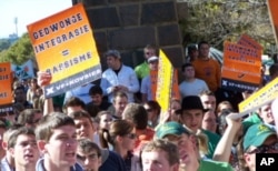 White Free state University students protest against what they term 'forced integration' of white and black students at the institution