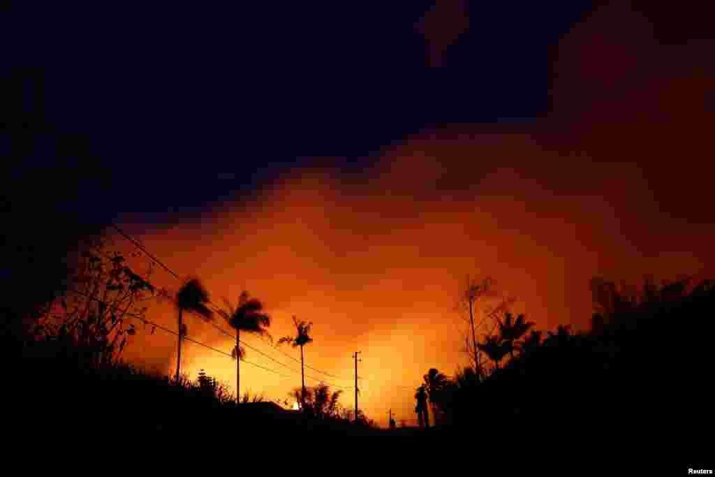 The night sky is illuminated by lava pouring from a fissure eruption of the Kilauea Volcano in the Leilani Estates near Pahoa, Hawaii.