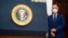 Dr. Anthony Fauci, President Joe Biden's top medical adviser, listens as Biden speaks about the COVID-19 variant named omicron, in the Roosevelt Room of the White House, Nov. 29, 2021.