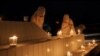 Women light candles during a candlelight vigil in honor of philanthropst Abdul Sattar Edhi in Quetta, Pakistan, July 9, 2016. 