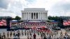 Two Bradley Fighting Vehicles flank the stage being prepared in front of the Lincoln Memorial, Wednesday, July 3, 2019, in Washington, ahead of planned Fourth of July festivities with President Donald Trump. 