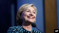 Former Secretary of State Hillary Rodham Clinton introduces her husband, former President Bill Clinton, and President Barack Obama at the Clinton Global Initiative in New York, Sept. 24, 2013.