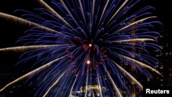 Fireworks explode over Chao Phraya River during the New Year celebrations amid the spread of the coronavirus disease (COVID-19) in Bangkok, Thailand, January 1, 2021. 