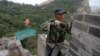 People work on the reconstruction of the Jiankou section of the Great Wall, in Huairou District, north of Beijing, China, June 7, 2017. 