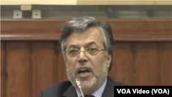 The sun rises as refugees and migrants walk to pass from the northern Greek village of Idomeni to southern Macedonia, Sept. 11, 2015. The sudden onset of autumn has taken tens of thousands by surprise all along the Balkans route from Greece to Hungary.