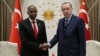 Turkey's President Recep Tayyip Erdogan, right, and Somalia's Prime Minister Hassan Ali Khayre shake hands during a welcome ceremony in Ankara, Oct. 26, 2017. Khayre visited victims of Mogadishu truck bombing being treated in Turkey.