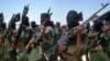 FILE - Islamist fighters loyal to Somalia's al-Shabab group perform military drills at a village in Lower Shabelle region, some 25 kilometers outside Mogadishu.