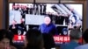People watch a TV showing a file image of North Korean leader Kim Jong Un during a news program at the Seoul Railway Station in Seoul, South Korea, Oct. 2, 2019.