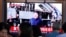 People watch a TV showing a file image of North Korean leader Kim Jong Un during a news program at the Seoul Railway Station in Seoul, South Korea, Oct. 2, 2019.