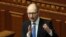 Ukrainian Prime Minister Arseniy Yatsenyuk, speaks to lawmakers during a session at the Ukrainian parliament in Kyiv, Ukraine, March. 27, 2014.