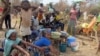 FILE - Refugees from Central Africa sit in the eastern Cameroonian village of Gado Badzere, near the city of Garoua-Boulai, not far from the border with Central Africa Republic.