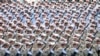 Iranian armed forces members march in a military parade, Sept. 21, 2016, marking the 36th anniversary of Iraq's 1980 invasion of Iran, in front of the shrine of late revolutionary founder Ayatollah Khomeini, just outside Tehran. 