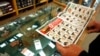 FILE - A customer looks through the in-store sales advertisements inside a store that sells guns in Texas. 