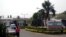 FILE - A man walk past signage for the National Hospital in Abuja, Nigeria, Jan. 14, 2016.
